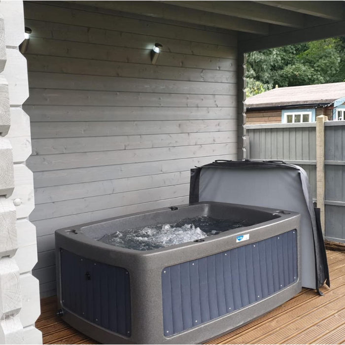 Couple relaxing in the RotoSpa DuoSpa S240 2 person hot tub