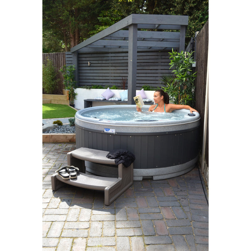 RotoSpa QuatroSpa 6 person hot tub in grey, side view