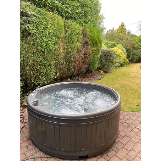 RotoSpa Orbis Round hot tub, angled view