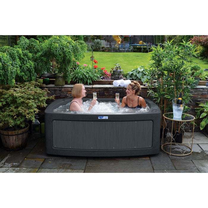 RotoSpa DuoSpa S240 2 person hot tub installed on an outdoor patio