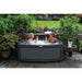 RotoSpa DuoSpa S240 2 person hot tub installed on an outdoor patio