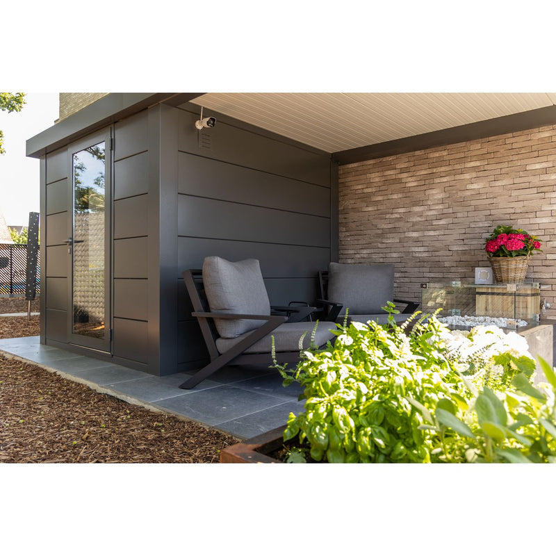 Telluria Luminato 2424 steel garden room in anthracite, manufacturer photography of a completed installation with an Open Lounge canopy