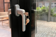 The lock supplied with the Telluria sliding doors, key in the barrel, which is what makes the closed-in building secure
