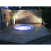 RotoSpa Orbis Round hot tub in a garden setting