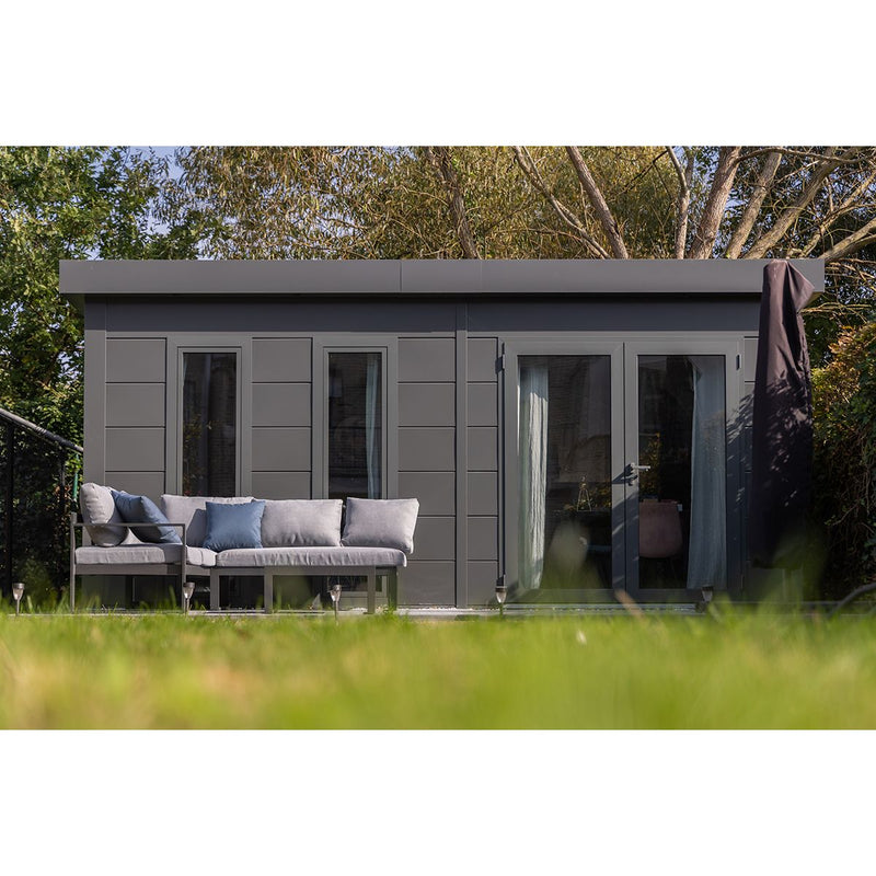 Telluria Luminato 5436 Plus garden room framed by lawn and mature trees, the double doors open onto a paved terrace with seating