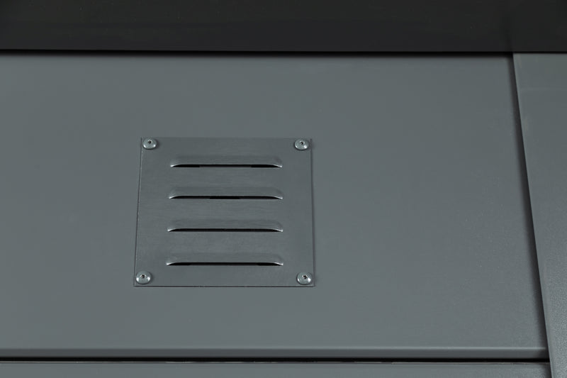 Close detail of the ventilation grille fitted as standard to a Telluria garage, set into the anthracite steel wall panel