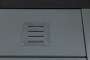 Close detail of the ventilation grille fitted as standard to a Telluria garage, set into the anthracite steel wall panel