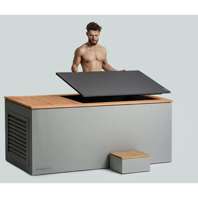 Tempered cold plunge cover being removed by man
